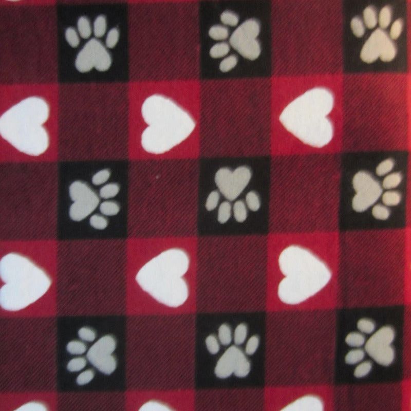 Close-up of hearts and paw print fabric in red and white, perfect for sugar glider cage accessories.