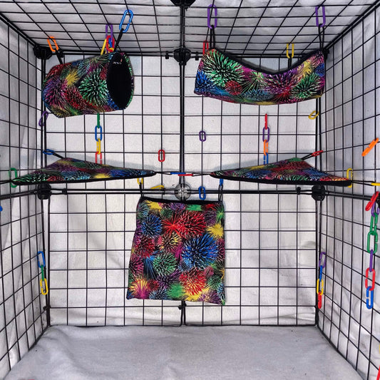 Firework print sugar glider expansion set with tunnel, hammock, shelves, and fleece accessories. Handmade cage add-ons for cozy glider play.