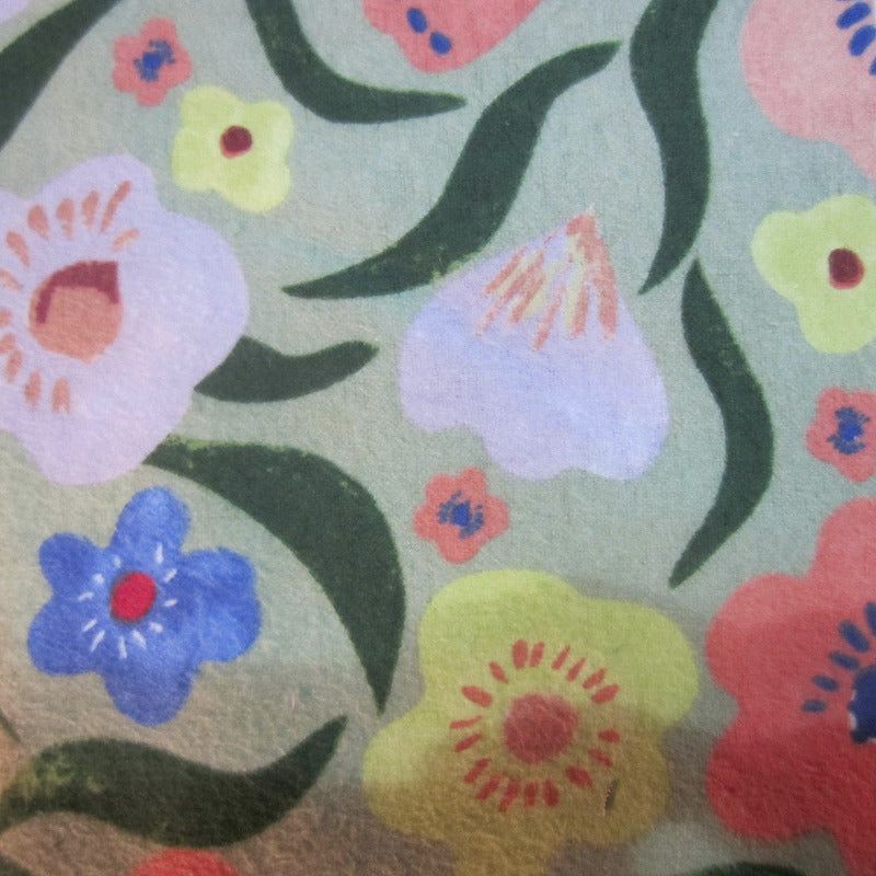 Close-up of Jungle Flowers fabric, showcasing bright tropical floral patterns used in the 17-piece Sugar Glider Cage Set.
