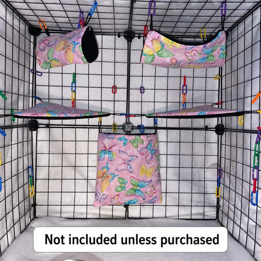 Pink butterfly print sugar glider expansion set in a display cage with tunnel, hammock, corner shelves, and hanging pouch with black interior fleece.