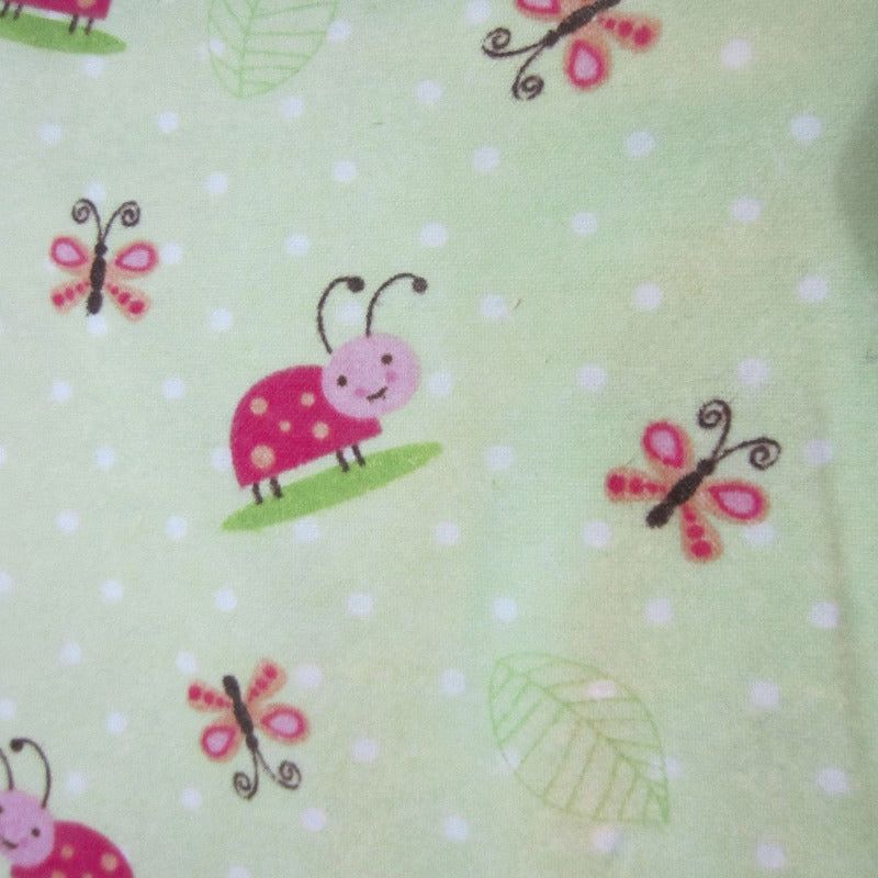 Close-up of fabric featuring a ladybug pattern, used in sugar glider cage accessories.