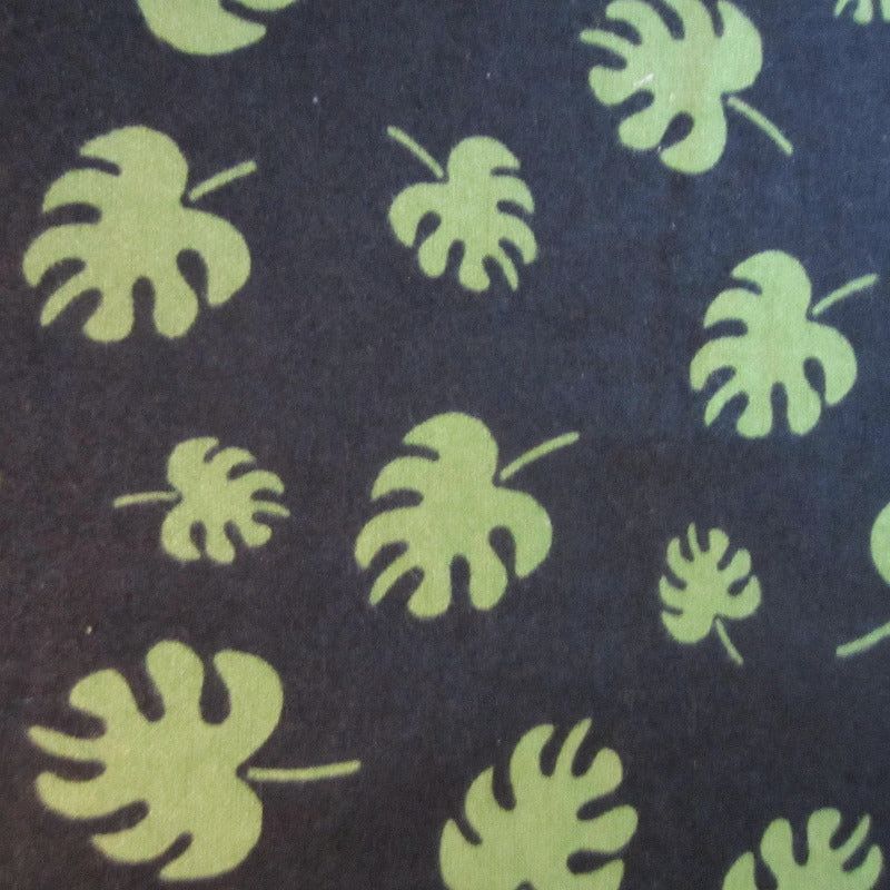 Close-up of leaf print fabric, ideal for sugar glider cage accessories.
