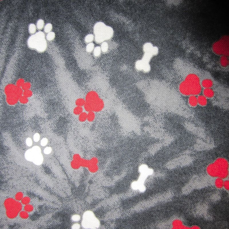 Close-up of tie-dye paw print fabric used in sugar glider cage accessories.