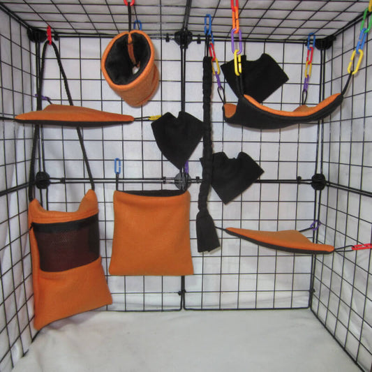 10pc Neon Orange fleece sugar glider cage set with Bonding Pouch, standard pouch, hammock, and accessories for a bright themed glider habitat.