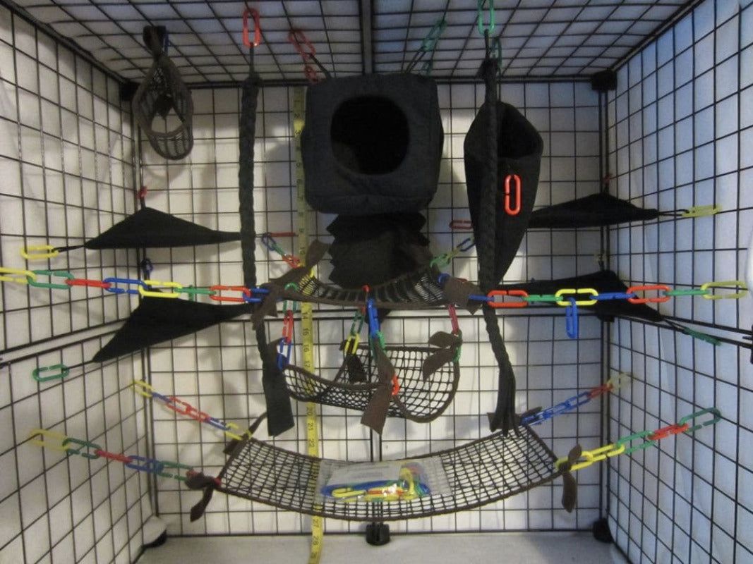 15-piece brown mesh sugar glider cage set with cube hideout, hammocks, pouches, and accessories for odor control and enrichment.