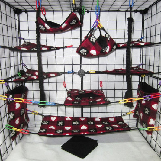 17-piece hearts and paw print fleece sugar glider cage set with hammocks, pouches, and cozy accessories for your glider's comfort.
