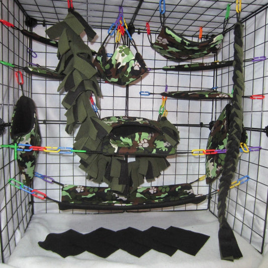 A cage set made in paw print camo fabric that is backed with fleece and shown inside of a metal wire display. Sugar glider climbing vines are swooping through the photo and look like good fun for gliders.