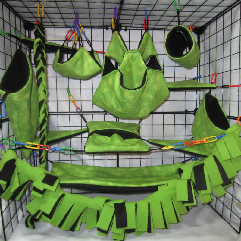 18-piece jungle green sugar glider cage set fully installed in cage with hammocks and pouches