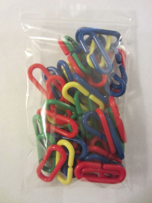 Bag of C-links for sugar glider cage setup. Durable plastic clips for hanging pouches, toys, and accessories in your glider’s enclosure.