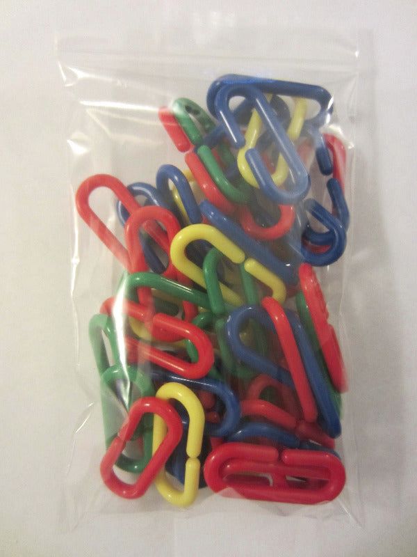 Bag of C-links for sugar glider cage setup. Durable plastic clips for hanging pouches, toys, and accessories in your glider’s enclosure.