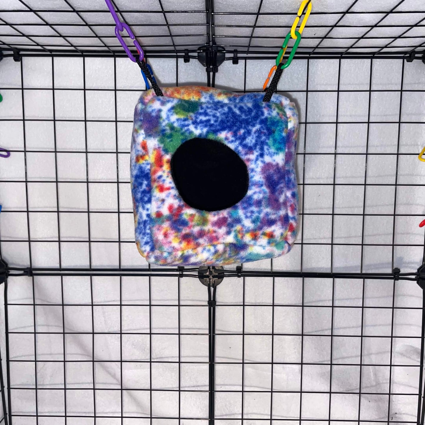 Colorful tie-dye sugar glider cube hideout made with soft fleece for cozy sleeping, climbing, and cage enrichment. Handmade in the USA.