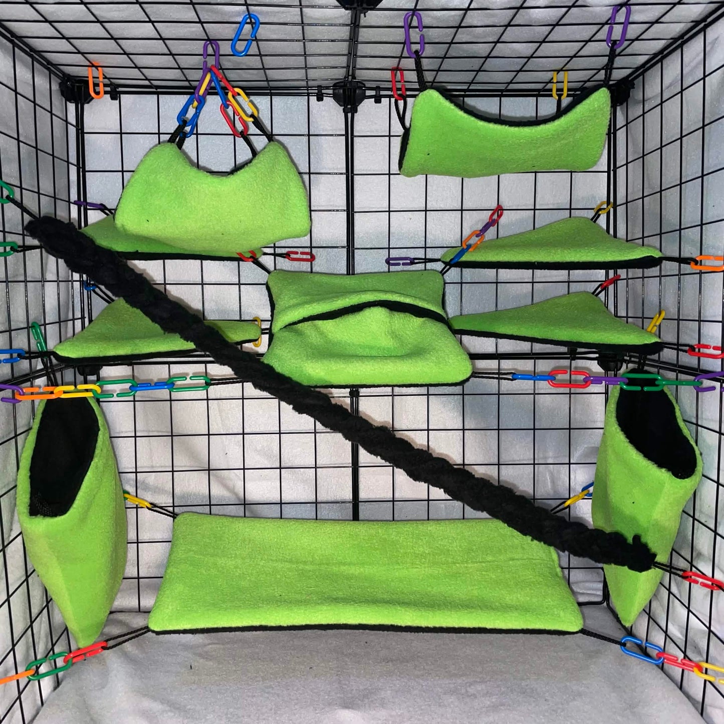 11-piece neon green fleece sugar glider cage set with hammocks, pouches, bridge, shelves, fleece vine rope, and C-links