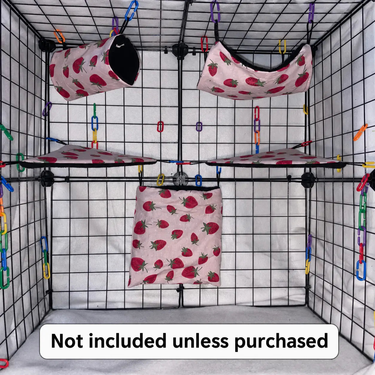 Pink strawberry sugar glider cage set with black fleece interior of pouches, hammocks, shelves, bridge, and braided rope inside a display cage.