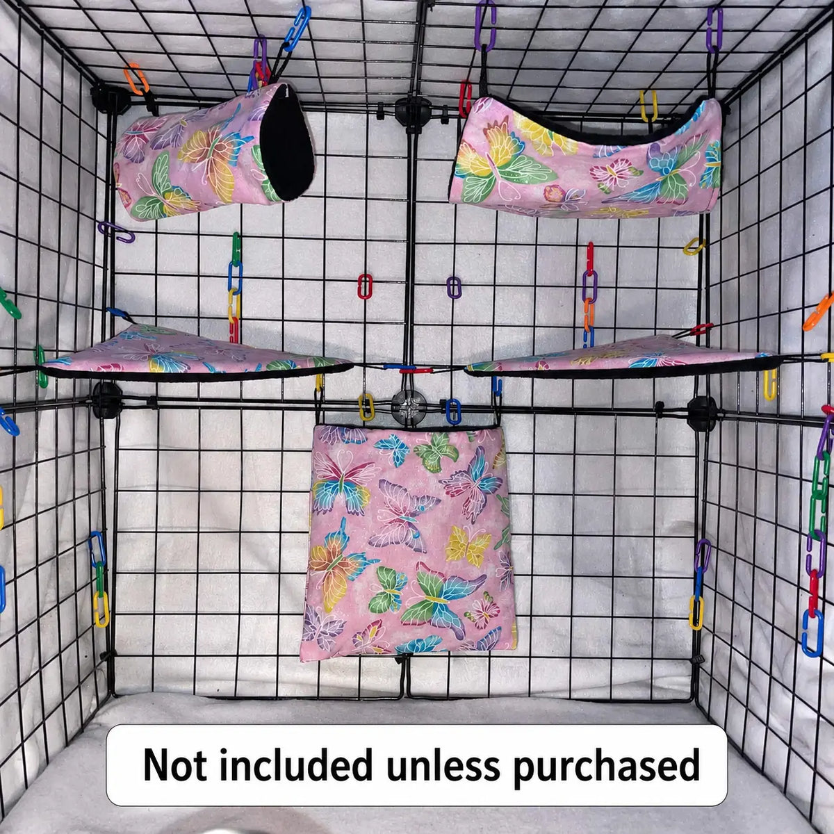Pink butterfly print sugar glider expansion set in a display cage with tunnel, hammock, corner shelves, and hanging pouch with black interior fleece.