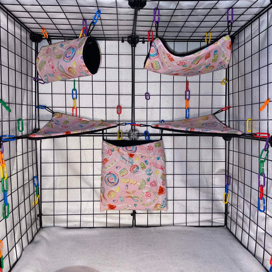 Pink candy print sugar glider expansion set with tunnel, hammock, corner shelves, and hanging fleece pouch.