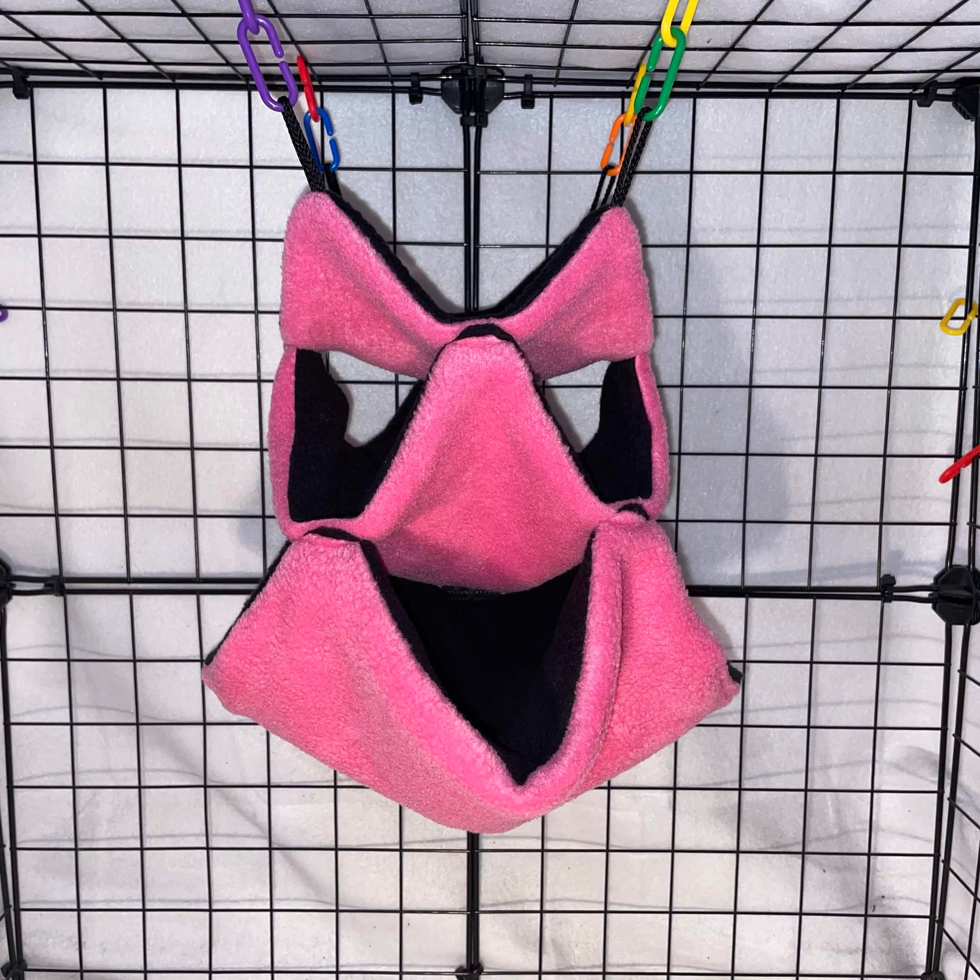 Pink fleece 3-tier honeycomb hammock for sugar gliders, made for cozy nesting, climbing, and cage enrichment. Soft handmade cage accessory.