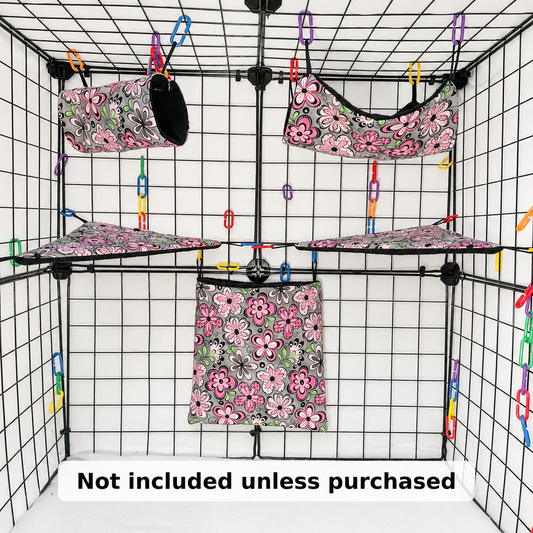 Pink floral print sugar glider expansion set with tunnel, hammock, shelves, and fleece accessories. Handmade cage add-ons for cozy glider play.