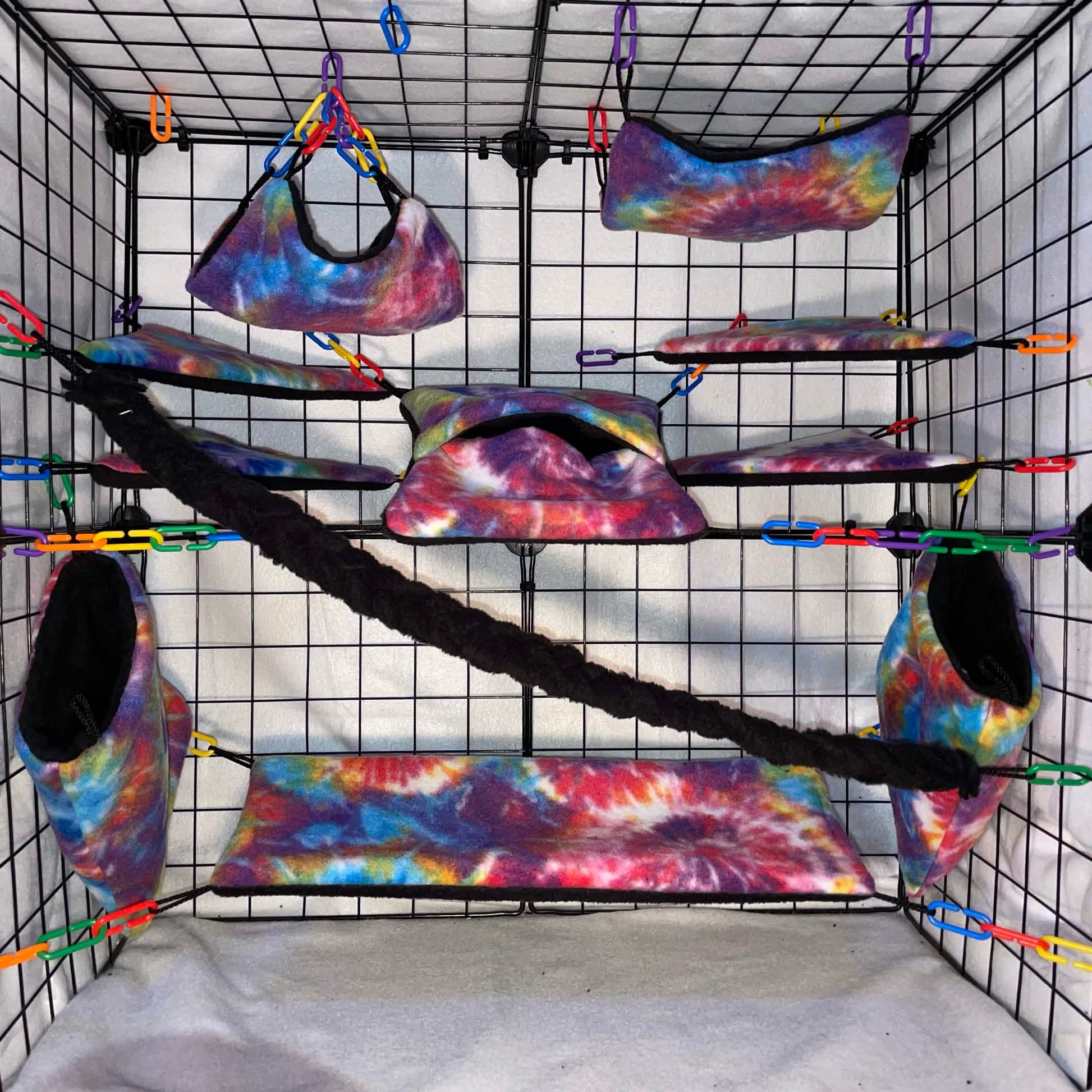Rainbow tie-dye sugar glider cage set with hammocks, pouches, bridges nand fleece vine. Handmade cage accessories for pet gliders.