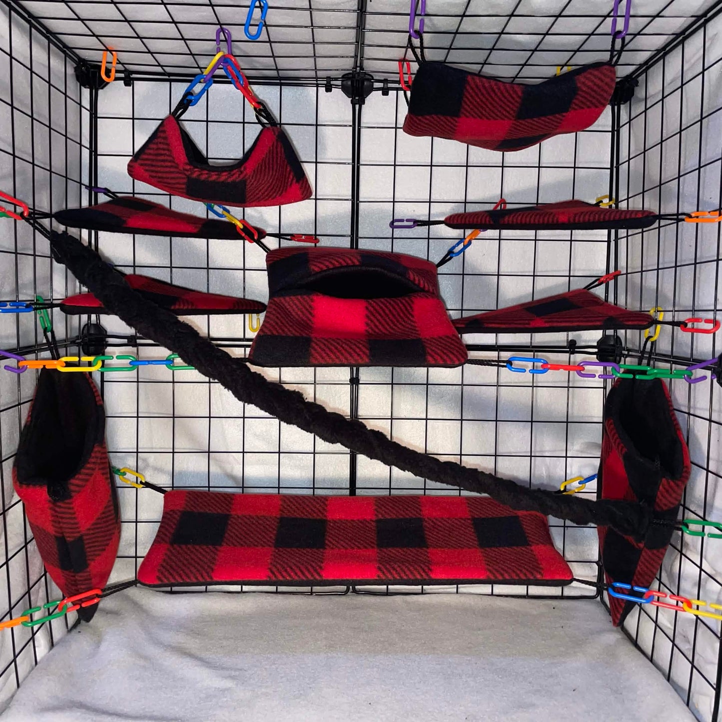 Red buffalo plaid sugar glider cage set with hammocks, pouches, bridges, and fleece vine. Handmade cage accessories for pet gliders.