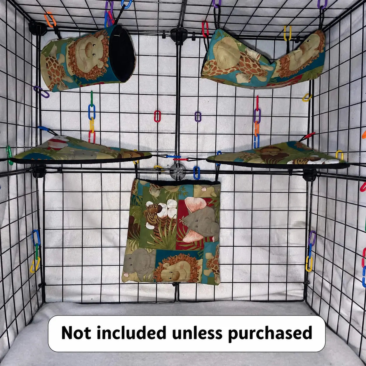 Safari animal print sugar glider expansion cage set with black interior lined pouches, hammocks, corner shelves, and colorful C-links inside a display cage.