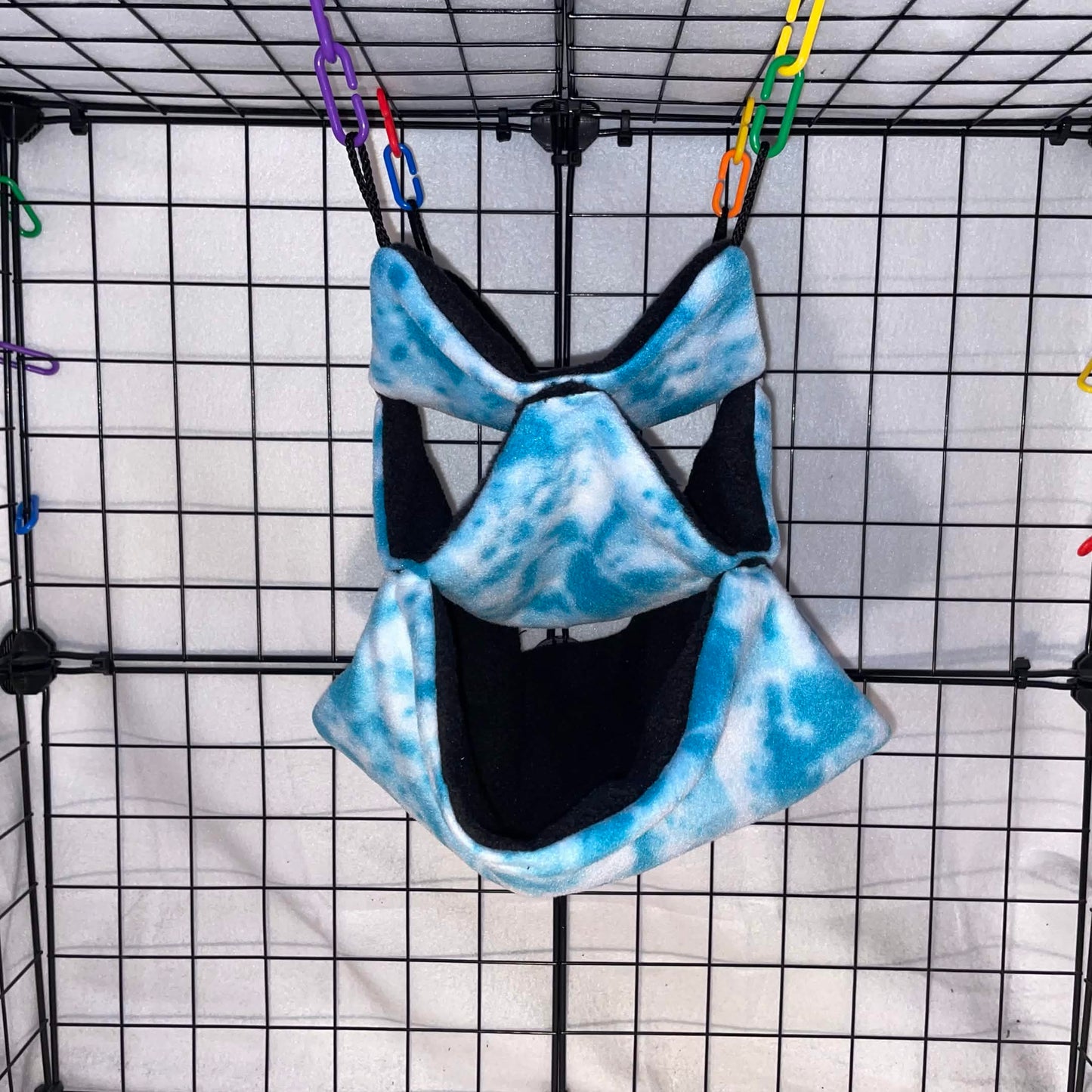 Sky blue tie-dye 3-tier honeycomb hammock for sugar gliders, made with soft fleece for cozy nesting, climbing, and cage enrichment.