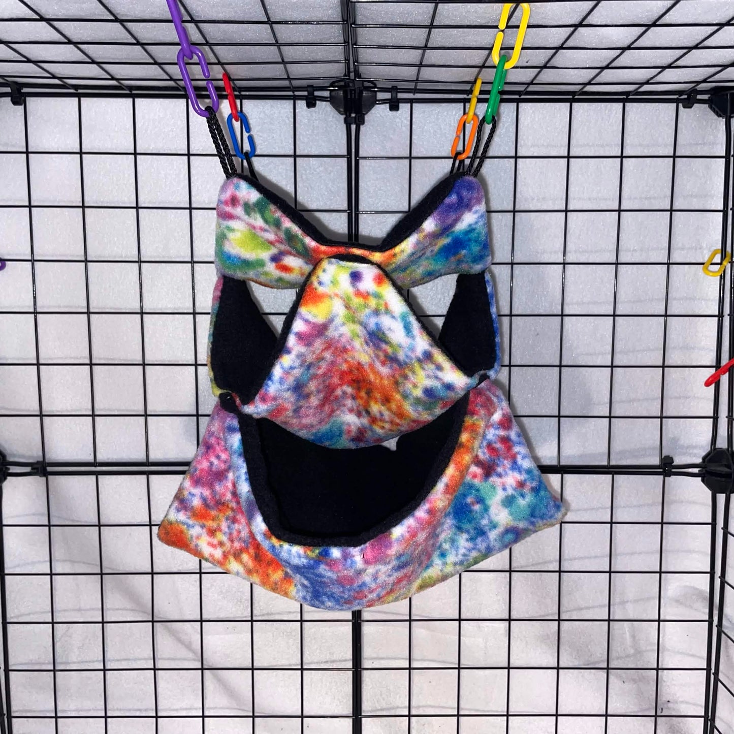 Bright paint spatter tie-dye 3-tier honeycomb hammock for sugar gliders, handmade with soft fleece for cozy nesting, climbing, and cage enrichment